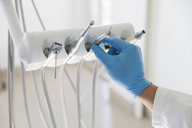 Professional Tooth Extraction technician working in St. Albans, VT